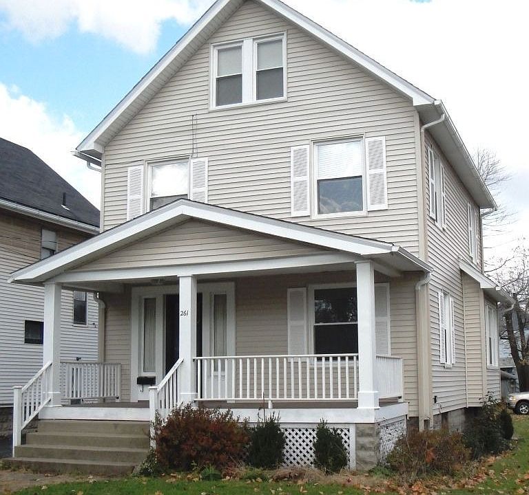 The home is on a corner lot with a lovely front porch.