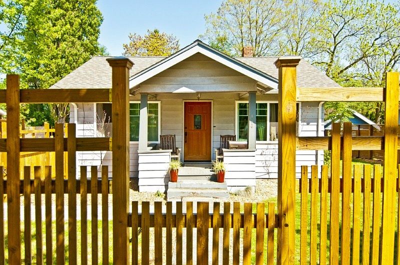 This 1924 Craftsman house charms you with its hip, breezy air & beckons w/an enchanting yard. Once inside you’ll see the large, open floor plan that everyone wants! Kitchen w/new appliances & gorgeous new black slate floor opens to formal dining room & LR that boast gleaming refinished wood floors. Updates abound with newer; roof, copper plumbing, sewer line, & PEX to house, tank less H2O heater, electrical service, “Low E” double paned windows, refinished hardwoods. Really..too many updates to list! Large fully fenced yard perfect for backyard entertaining & BBQs has garden space, mature trees & a fire pit with plenty of room for everyone to enjoy. Detached garage w/RV parking or 4+ tandem cars. Room to expand; the unfinished basement has enough space to add 4th & 5th bedrooms (buyer should verify with city) & a family room or whatever you wish! Bonus – amazing neighbors & walking distance to popular dog park! Hurry, this exceptional place won’t last long!!!