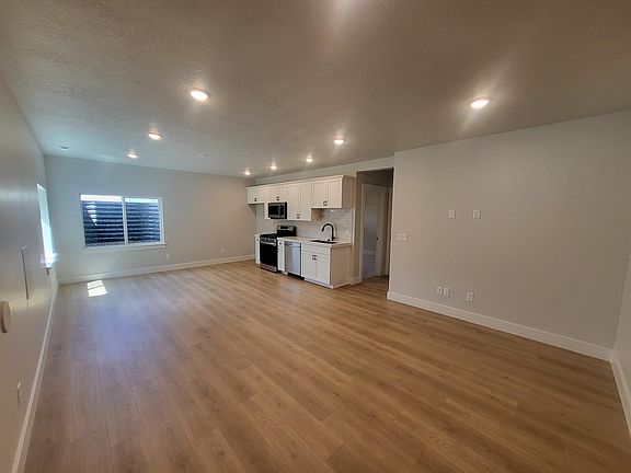 open family room with kitchen all new appliances except refrigerator.