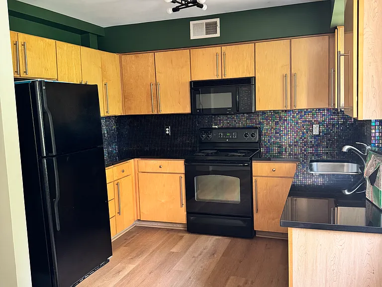 Colorful kitchen that is part of the open concept living space.