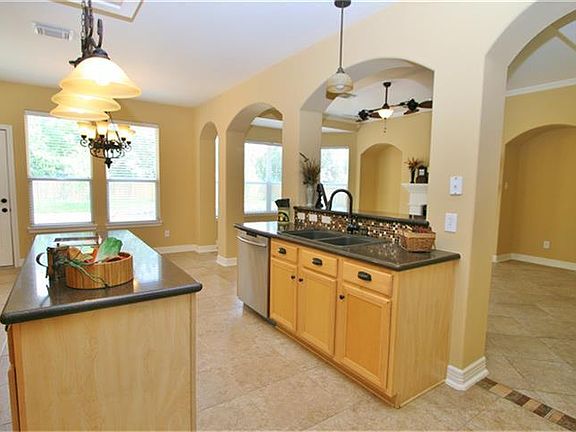 Whether it is family hanging out or entertaining this is the perfect kitchen. TONS of space, cabinets, counters and so comfortable.