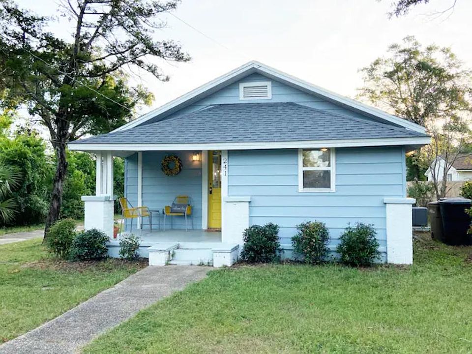 Front of house with long driveway on the left side