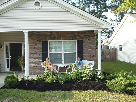 Front yard with tree and lig