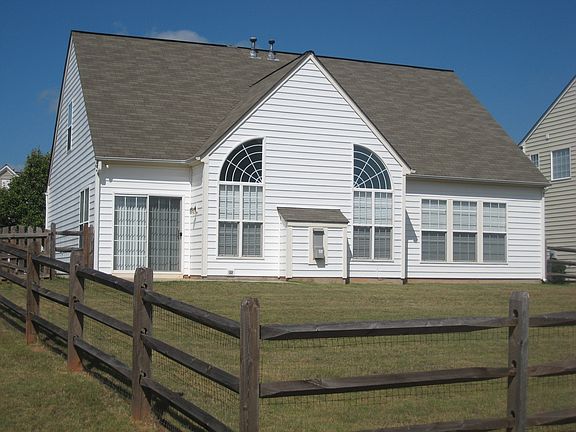 Fenced-in back yard with patio