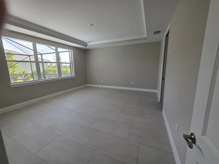 Primary bedroom with tray ceiling