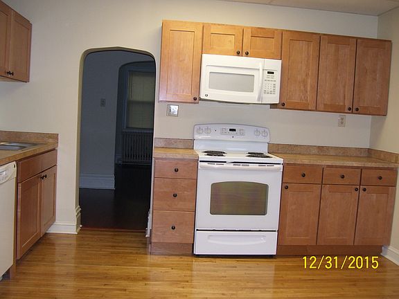 Kitchen with electric range, built-in microwave & cabinets