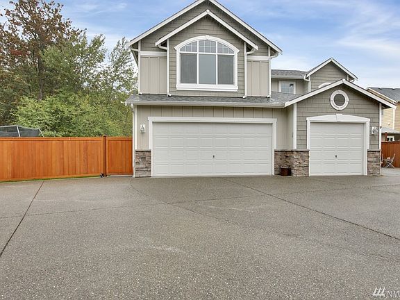 3 car garage with ample driveway and RV parking !