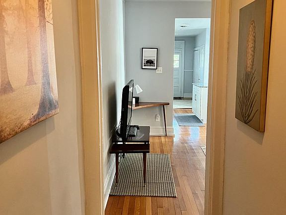 Cozy front entry with warm hardwood floors.