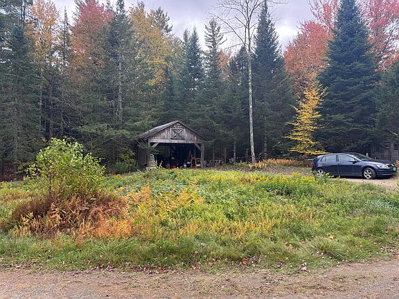 The property is surrounded by woods.