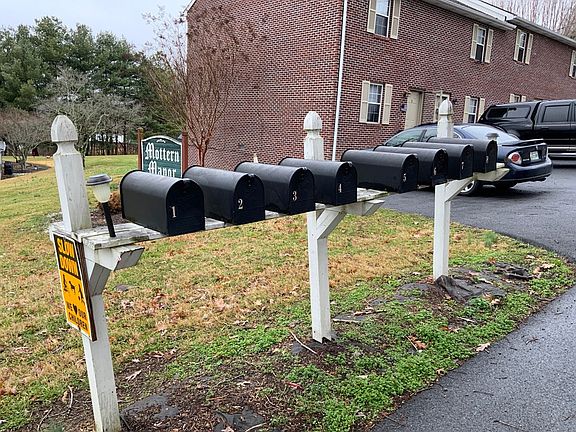 Mailboxes located next to building