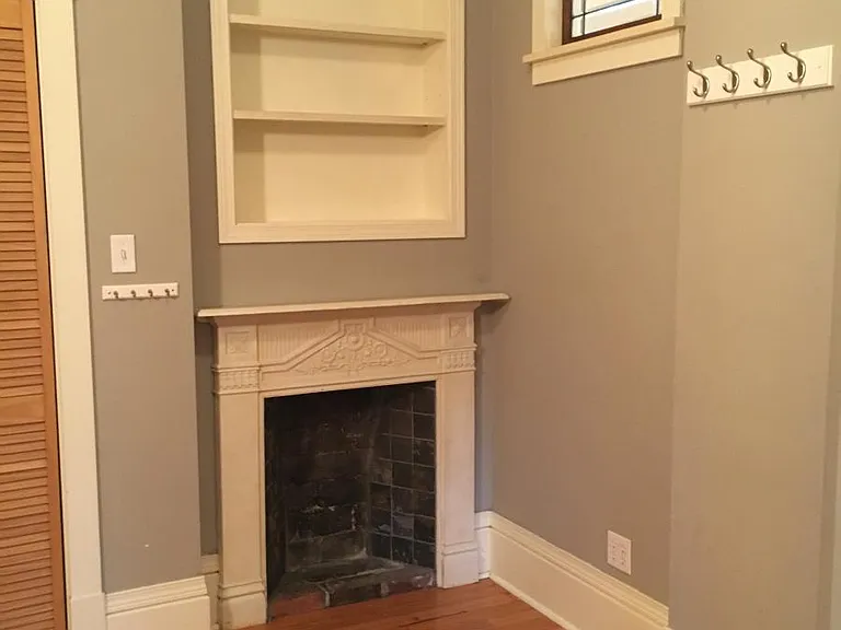 decorative fireplace surround in bedroom