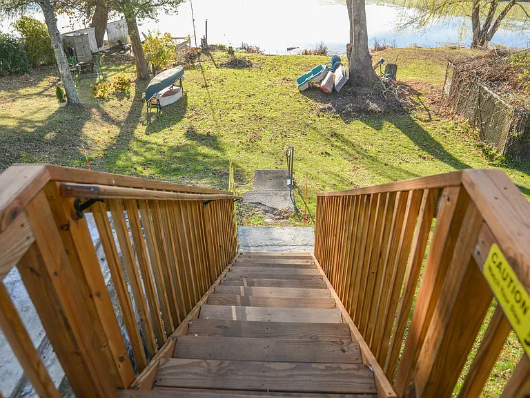 Staircase going down to the the backyard. Only use this staircase to access the backyard. Please watch your steps as it may becomes slippery when wet. During winter months, we won't allow guests to access the backyard