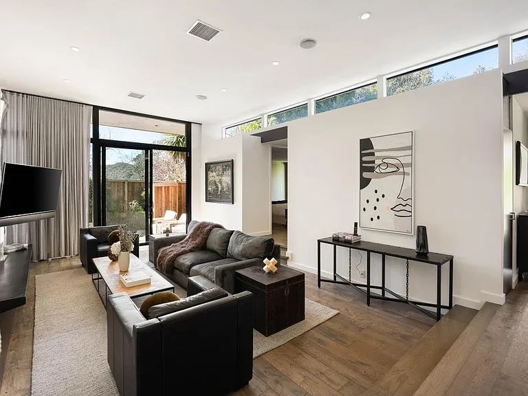 Step into an inviting, light-filled living area, crafted for your relaxation and enjoyment throughout your stay.