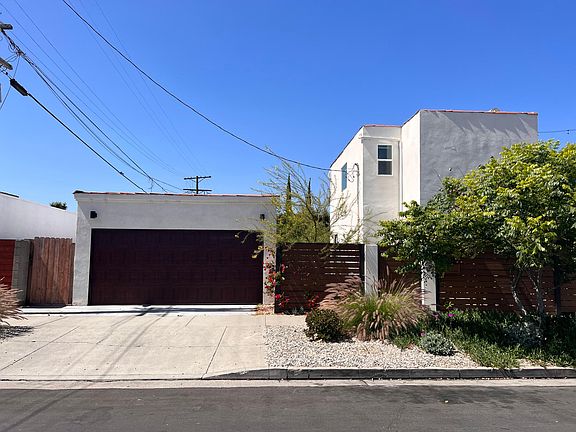 Detached 2-car, side-by-side air-conditioned garage with storage and separate air-conditioned office.