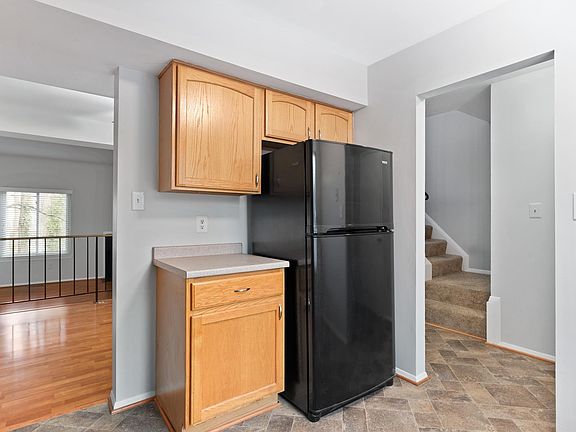 Light filled kitchen open to foyer and dining room