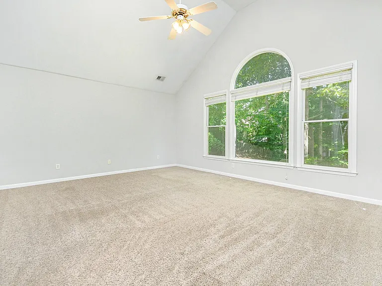 Massive Master Bedroom with a view of Private Backyard.
