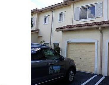 Clopay Modern Steel Collection Garage Door On A Contemporary Florida Home Installed By Adco Garage Doors Www C Modern Garage Doors Garage Doors Modern Garage