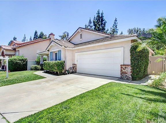 home with two car attached garage. Direct access to home. Side gate leading to the back yard.