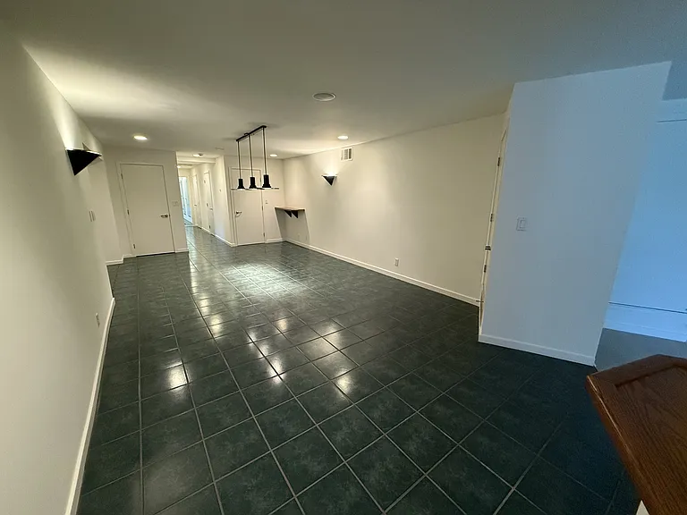 Downstairs hallway and loft area is a game room with space for a Billard table.