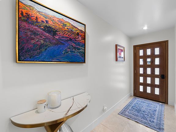 New solid wood custom doors throughout the home. This is the entry to the condo.