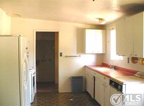 Has dishwasher & stove, the laundry area and 1/2 bath are beside the kitchen.