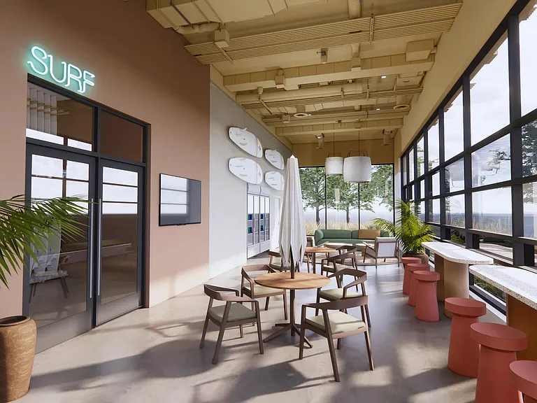 Surf Shack lounge with open-air doors and a variety of seating options facing the shore.