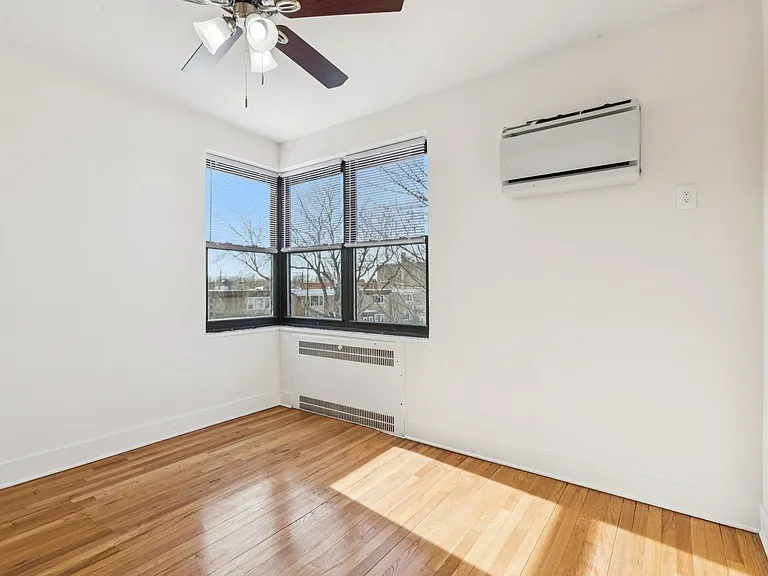 Bedroom #2 with built-in wall A/C unit