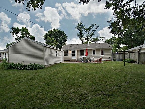 View of the fully fenced backyard and great patio.