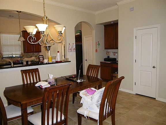 DINING AREA WITH BAR OPEN TO KITCHEN