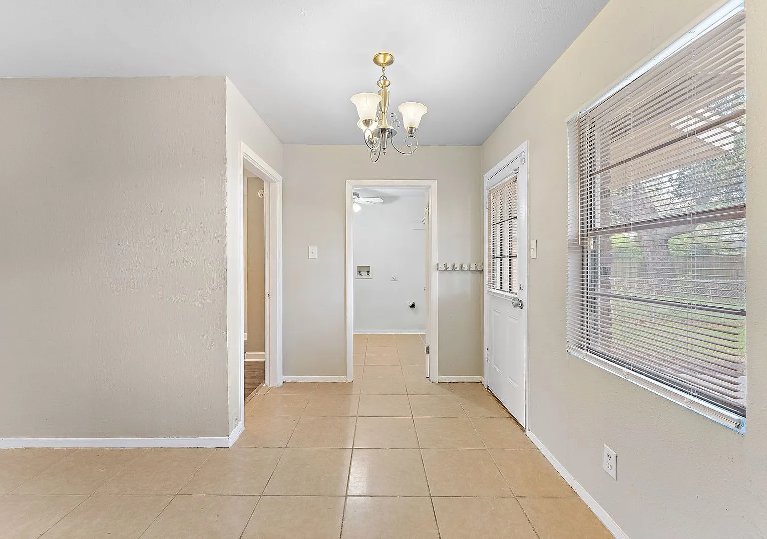 Beautifully remodeled 4 bedroom bath and a half with ceramic tile through out and laminate floori... — Photo 4