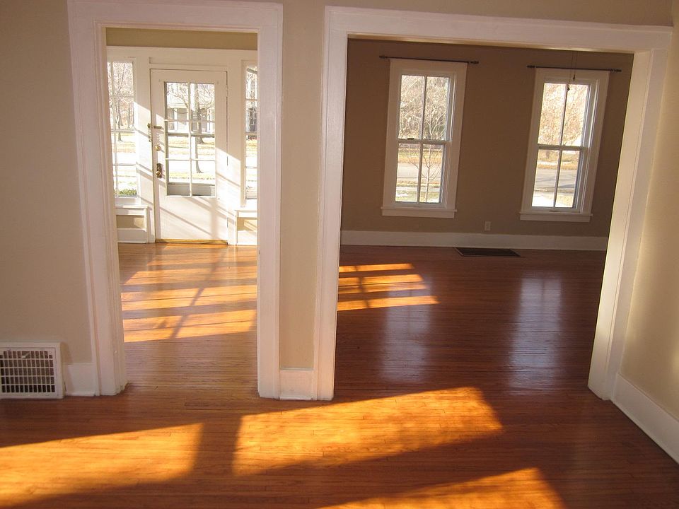 Sunroom (left), living room (right) and dining room (foreground).