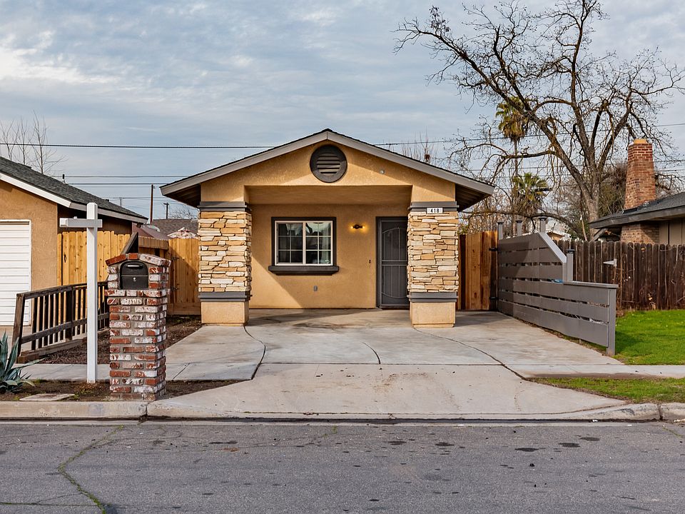 Attached is a carport and front porch, with a new fence on the right with solar lights on the fence and a security light attached to the front of the home keeping, the home well light at night. There is a security screen on the front door as well.