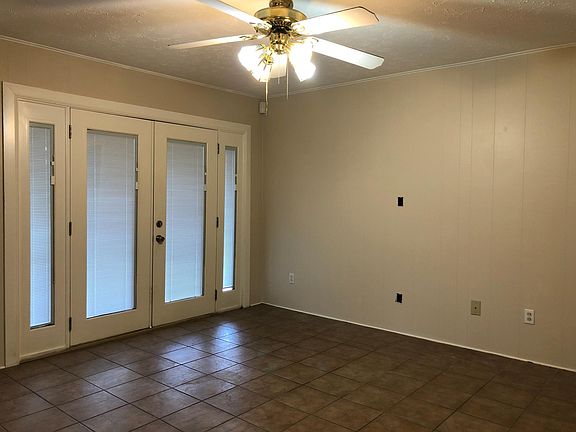 The living area has direct access to the back patio.