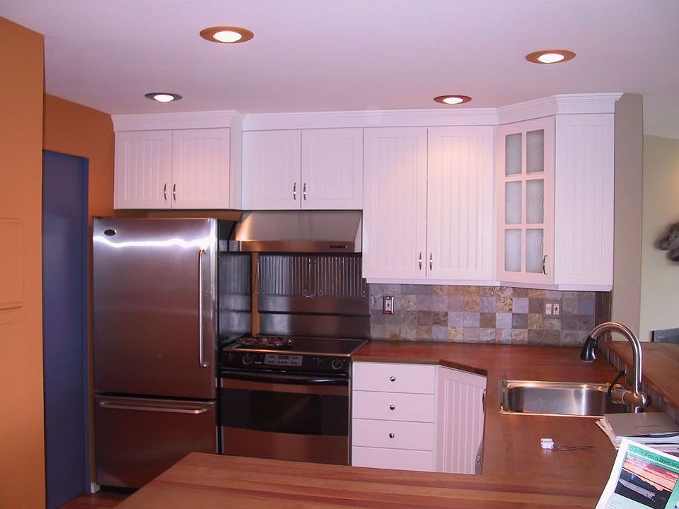 handsome madrone wood countertops with slate backsplash