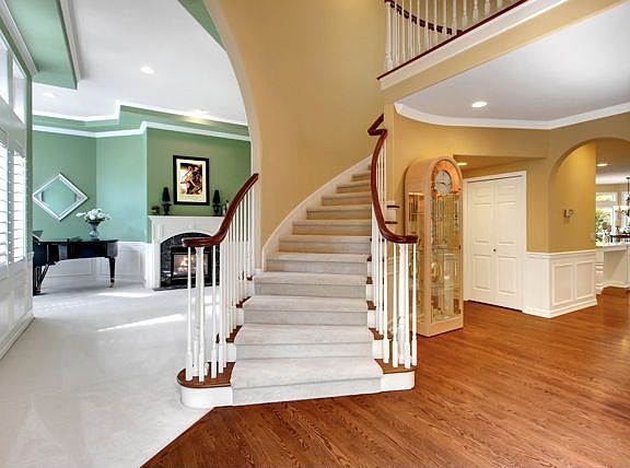Enter to grand ceilings and a sweeping curved staircase...Envision prom dresse