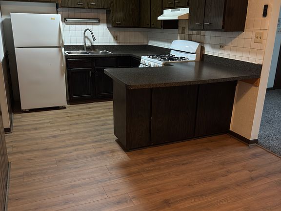 Kitchen with breakfast bar and dining area