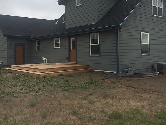 Back of home with deck