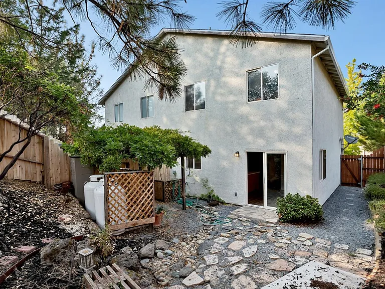 A view of the back of the home from in the backyard.