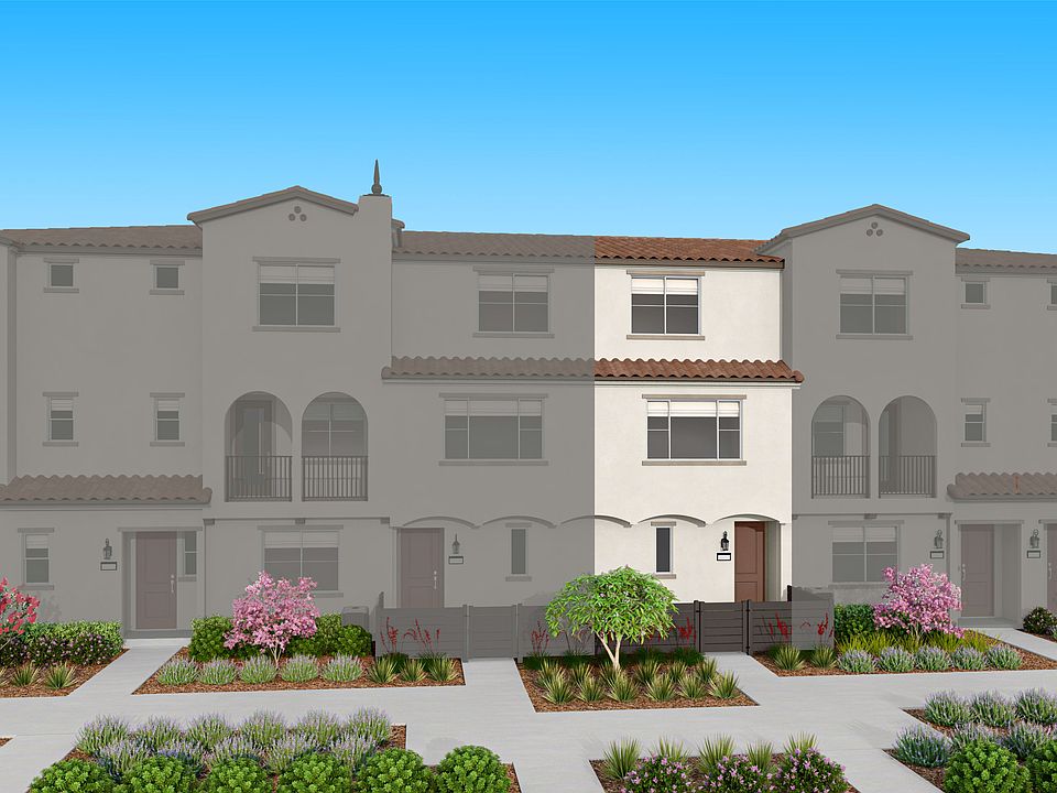 The image depicts a multi-story residential building with a Mediterranean-style architecture, surrou