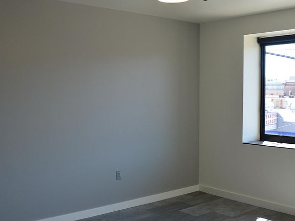 Bedroom/Office, full bath, walk in closet, opening south facing windows with solar shades