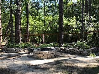 Backyard paradise with deck and fire-pit. Backs to protected land