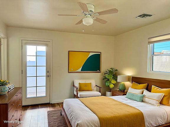 Awesome bedroom with French door leading to the private enclosed backyard and patio.Lots of natural light and a ceiling fan!