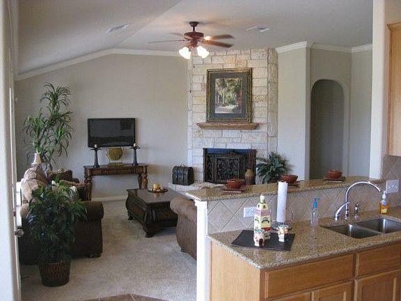 Kitchen opens to family room and features breakfast bar