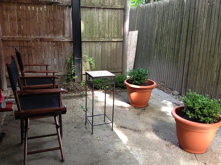 Private patio includes two garden beds (furnishings not included)