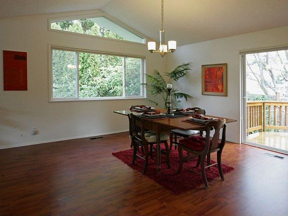 Dining room opens up through sliding glass door to lovely deck.