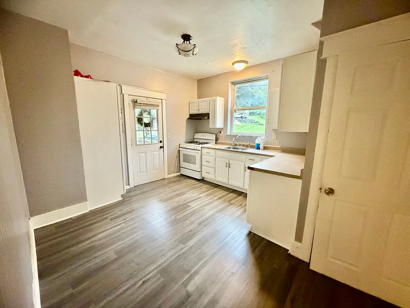 Spacious 3-Bedroom, 2-Bath Home with Large Deck & Off-Street Parking — Photo 4