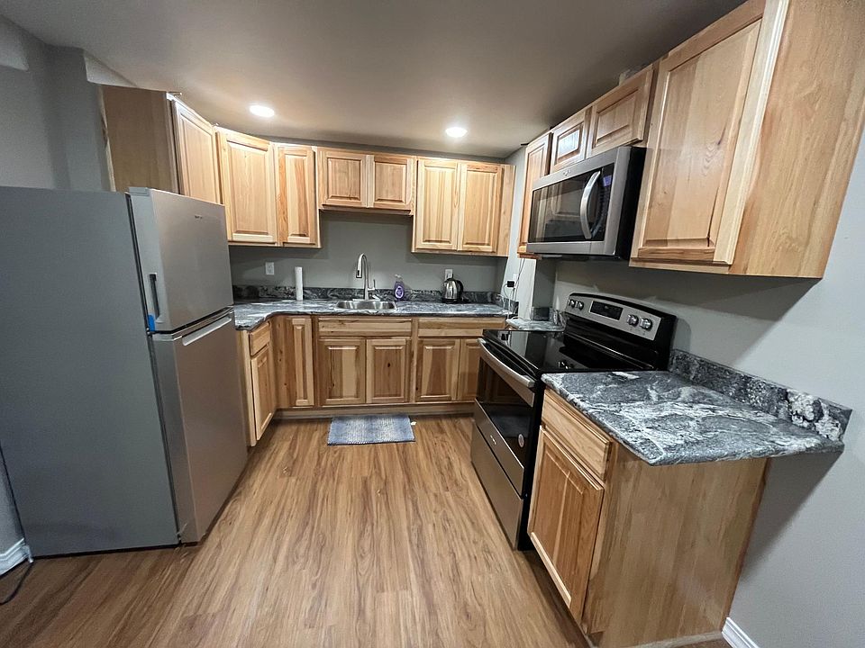 Full kitchen with all new appliances and granite countertops. Fully stocked with cookware, plates, glasses, silverware, spices, and oils.