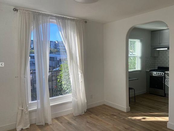 Beautiful arch window. original vintage architecture kept with remodel.