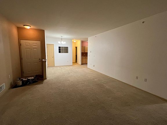 Entry way, living room and dining room. Coat closet in dining room.