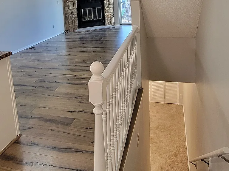 Stairs to fully finished basement.